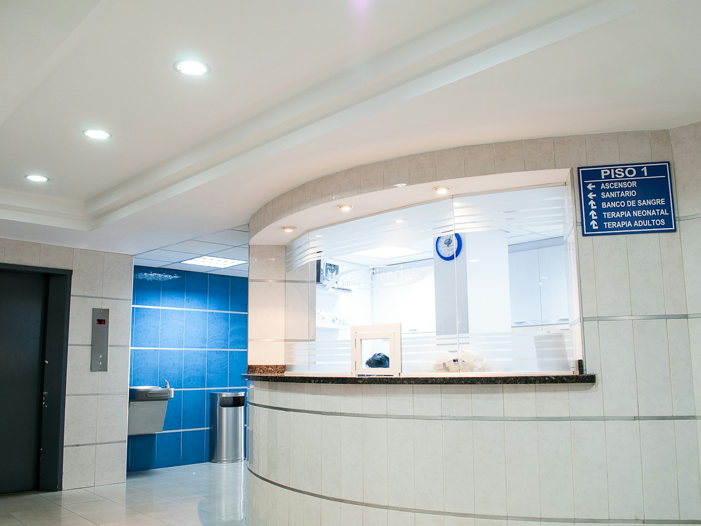 The reception desk of a bright, quiet clinic